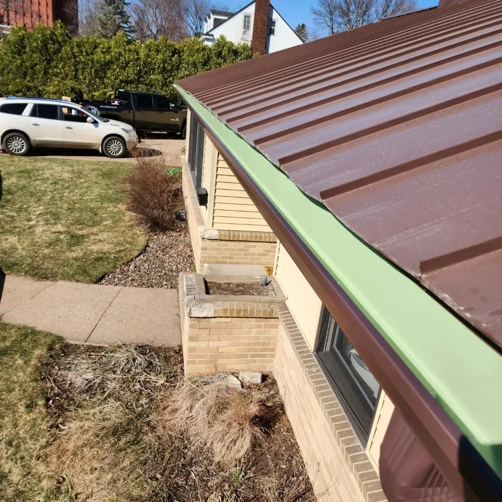 Slide of Dillon's Seamless Gutters and Roof Solutions