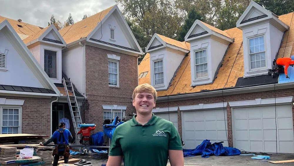 Slide of DIM Construction and Roofing