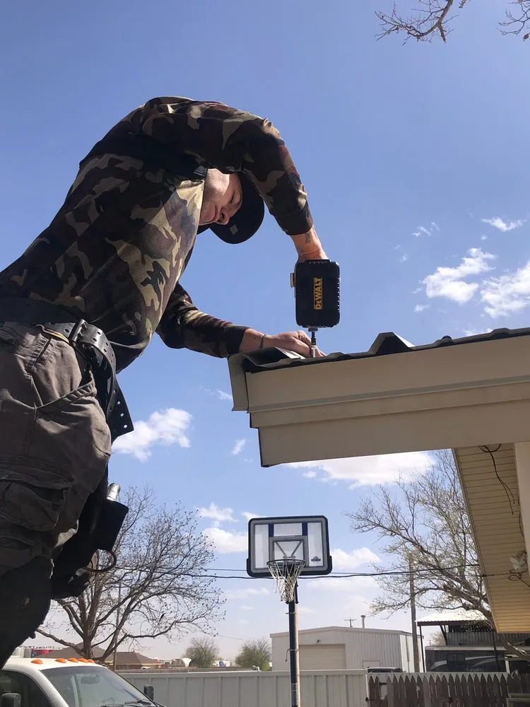 Slide of Dinger Roofing