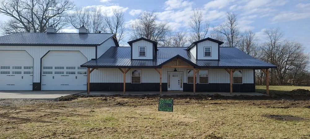 Local storm damage roof repair in Milroy, IN by Distinctive Construction