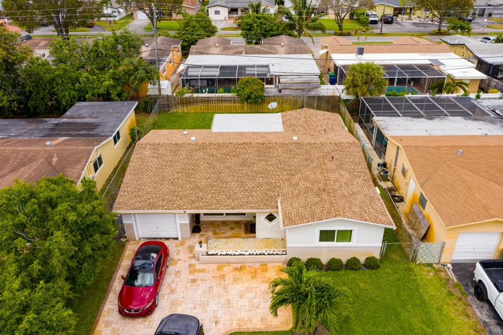 Licensed roof replacement for residential properties in Opa-locka, FL by DM Roofing Company