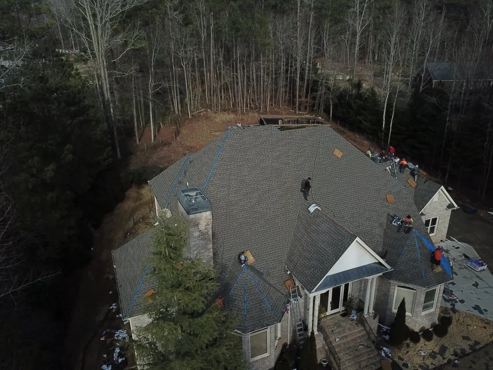 Slide of DOM Roofing & Restoration