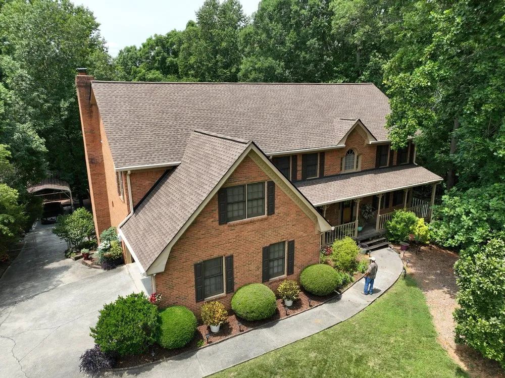 Slide of DOM Roofing & Restoration