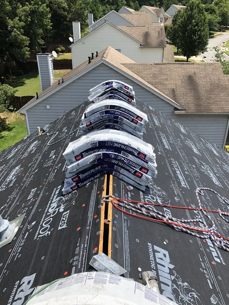 Slide of DOM Roofing & Restoration