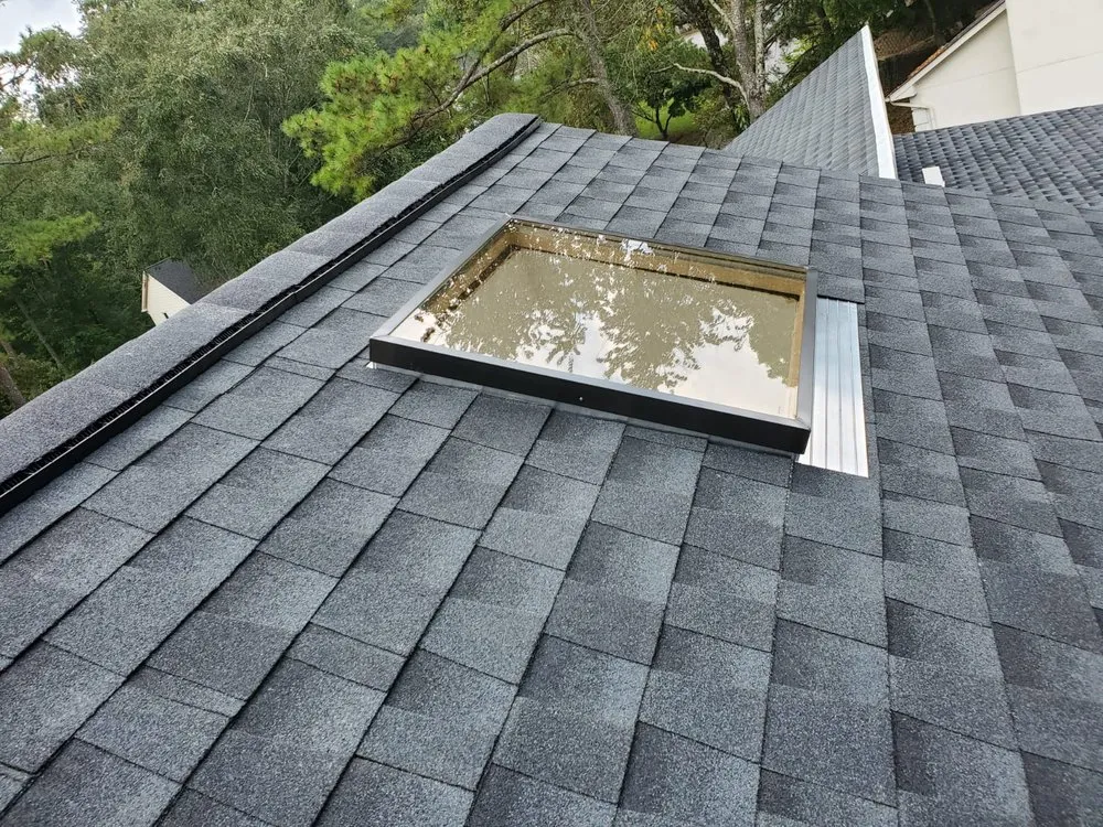 Slide of DOM Roofing & Restoration