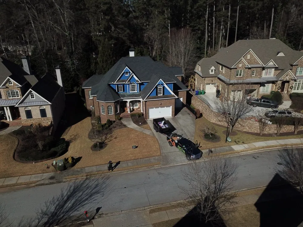 Slide of DOM Roofing & Restoration