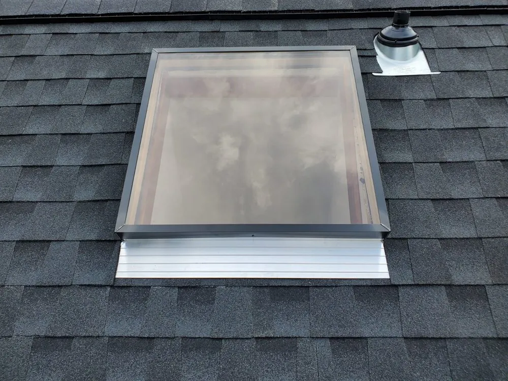 Slide of DOM Roofing & Restoration