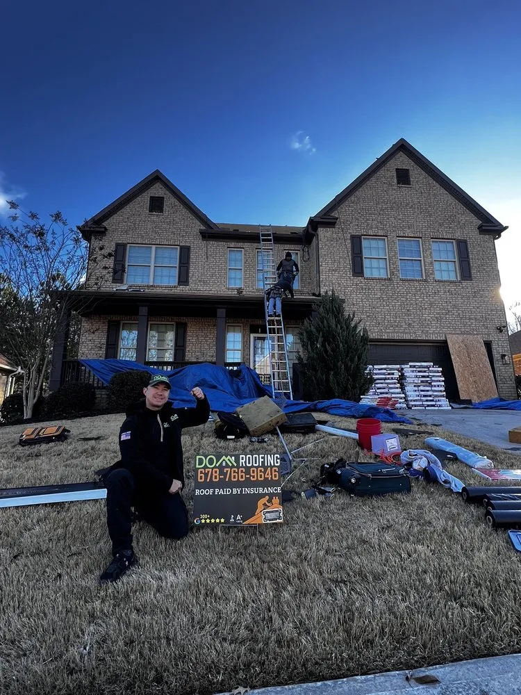 Slide of DOM Roofing & Restoration