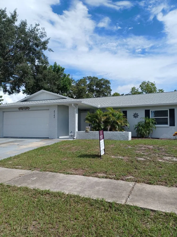 Slide of Dunedin Roofing