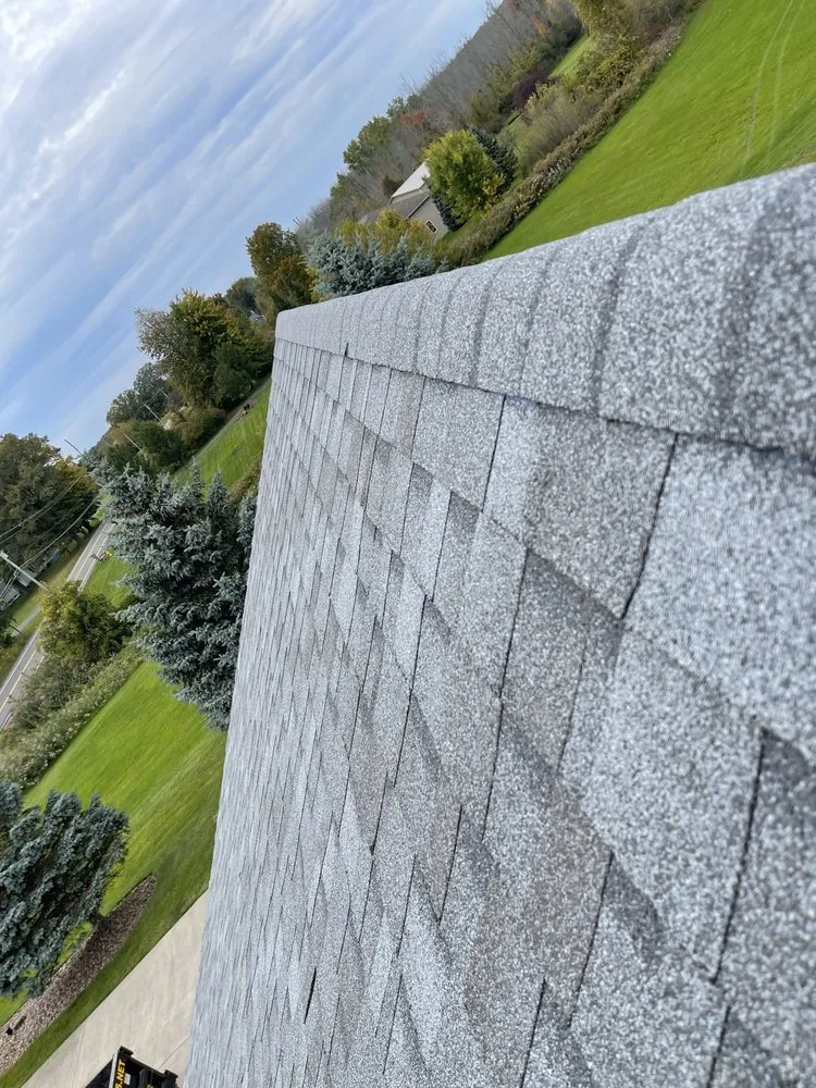 Slide of Dynasty Roofing