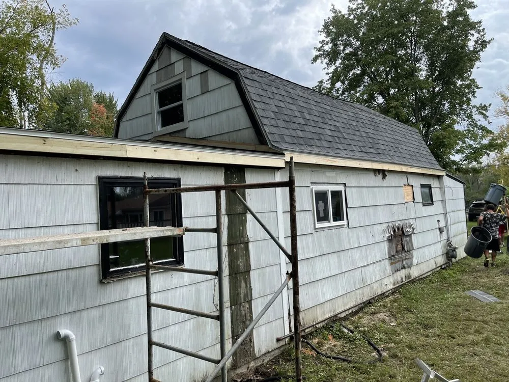 Slide of Dynasty Roofing