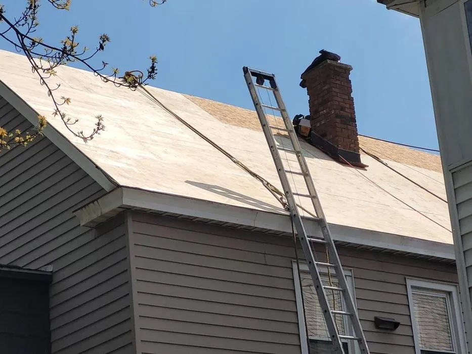 Slide of E-Mont Roofing