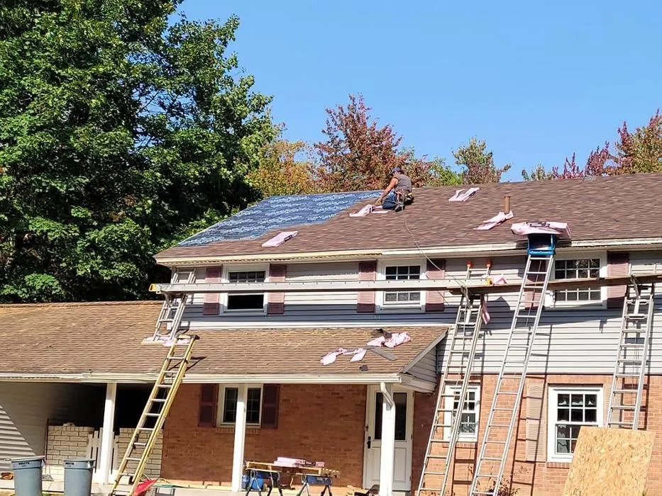 Slide of E-Mont Roofing