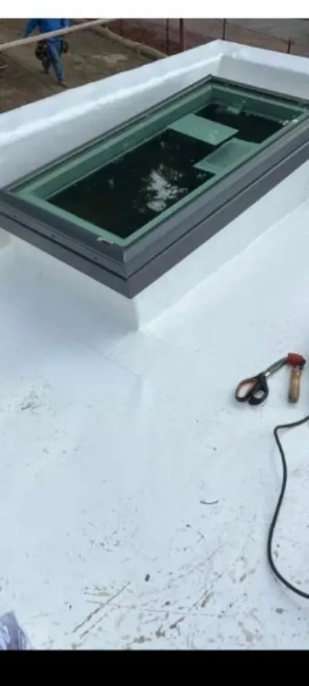 Slide of E. Thompson Roofing