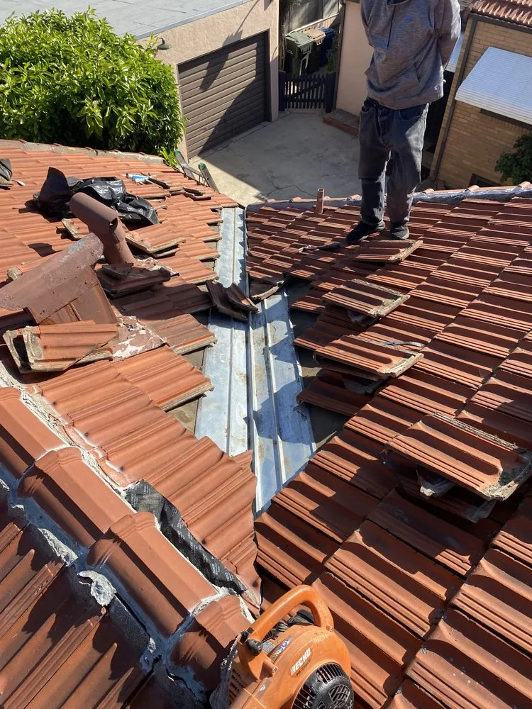 Slide of East Bay Roofing