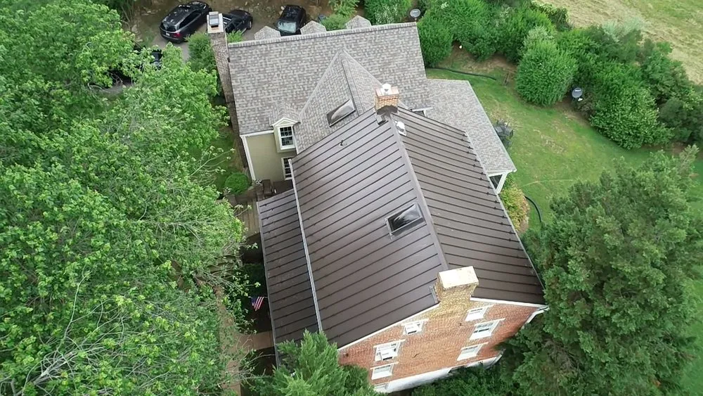 Licensed shingle roofing service in Brookeville, MD by East West Contractors