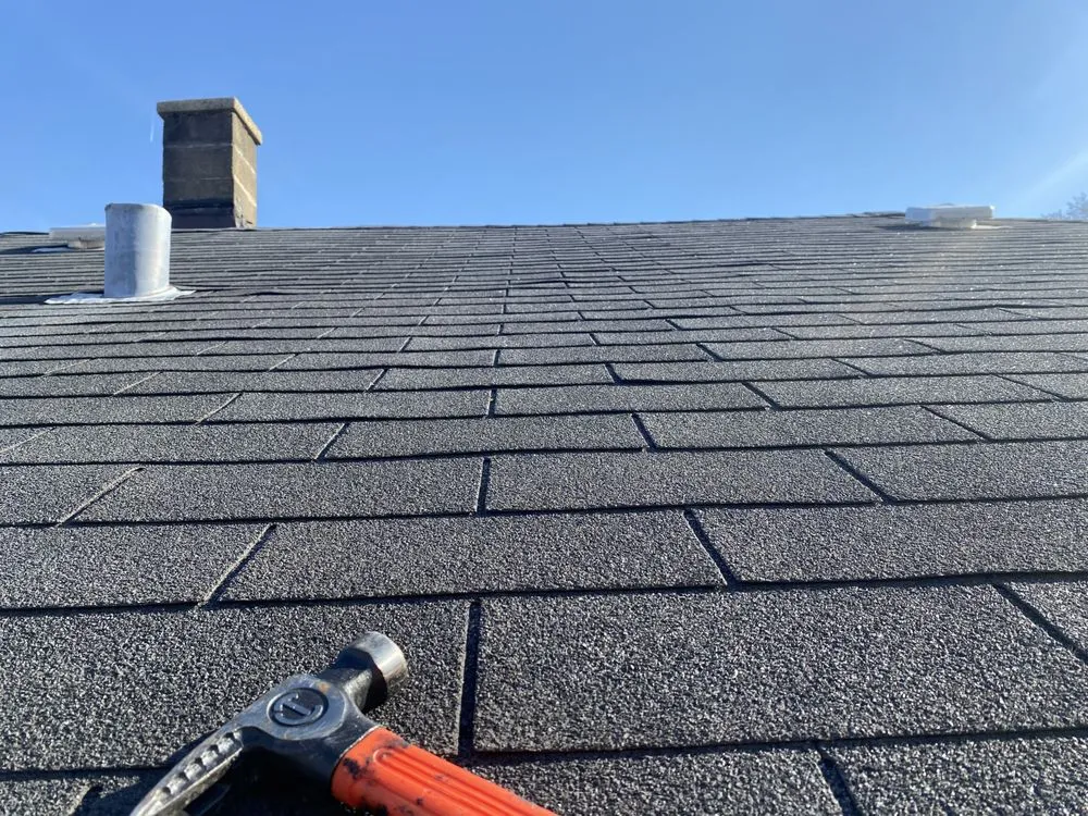 Slide of Economy Roofing Team