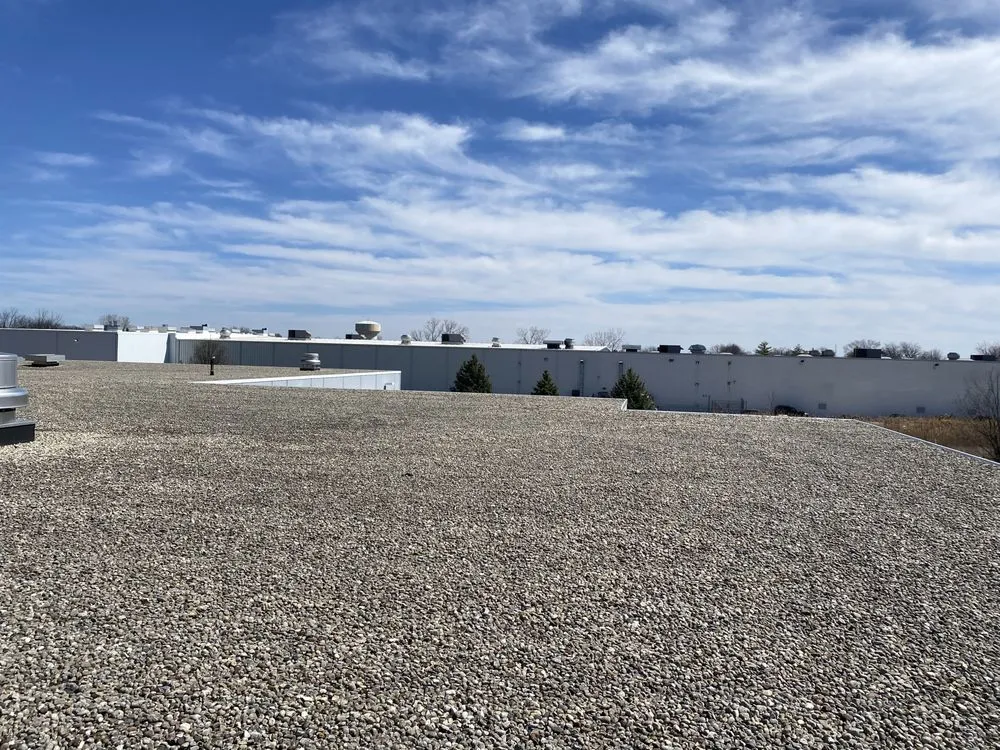 Slide of Economy Roofing Team