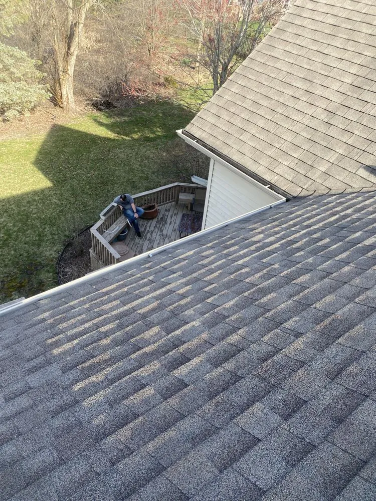 Slide of Economy Roofing Team