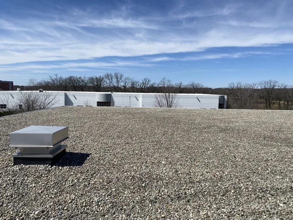 Slide of Economy Roofing Team