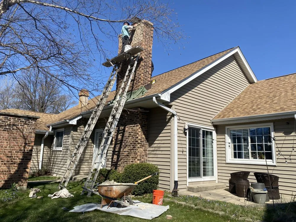 Slide of Economy Roofing Team