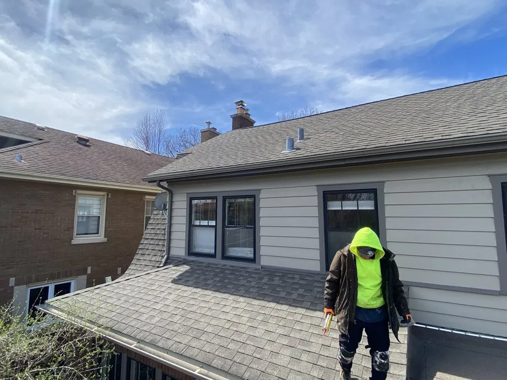 Slide of Economy Roofing Team