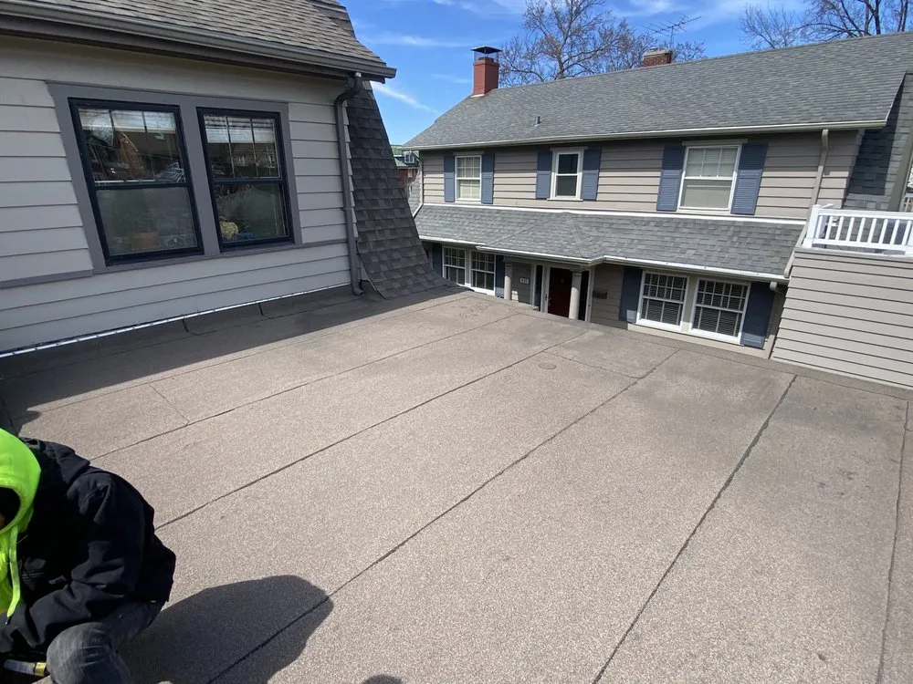 Slide of Economy Roofing Team