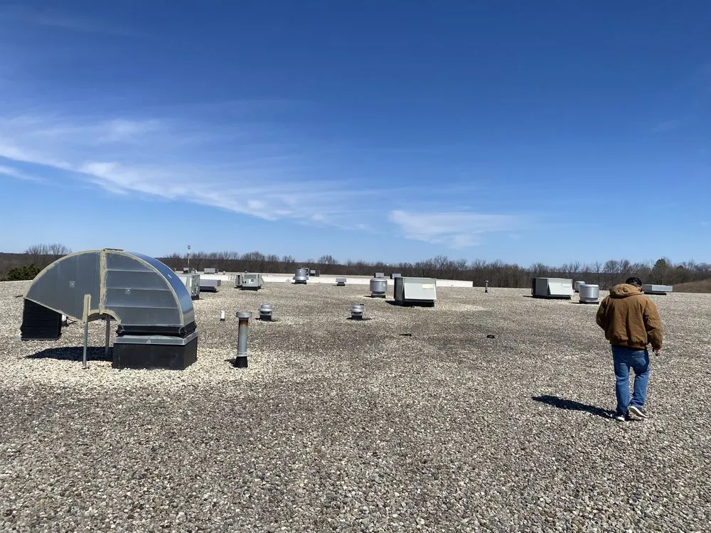 Slide of Economy Roofing Team