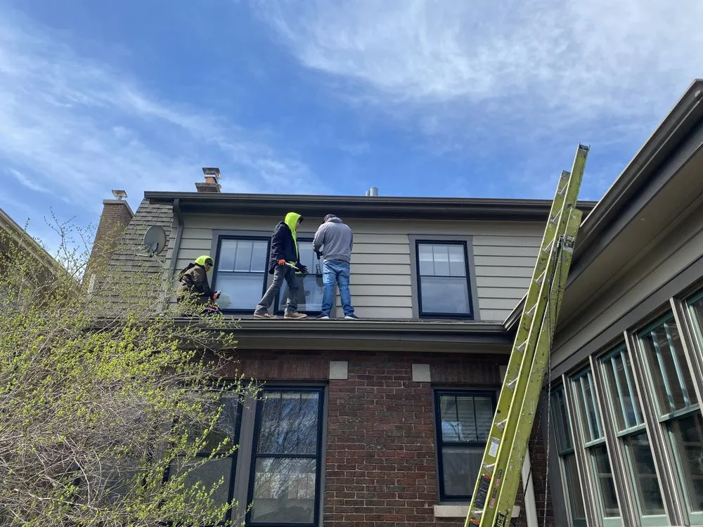 Slide of Economy Roofing Team