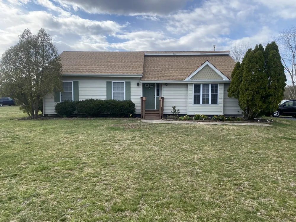 Slide of Ed's Roofing & Siding