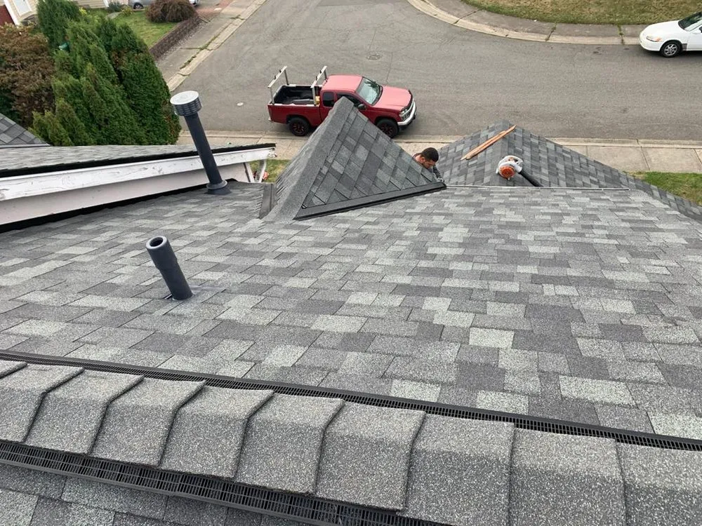 Slide of E&J roofing and construction