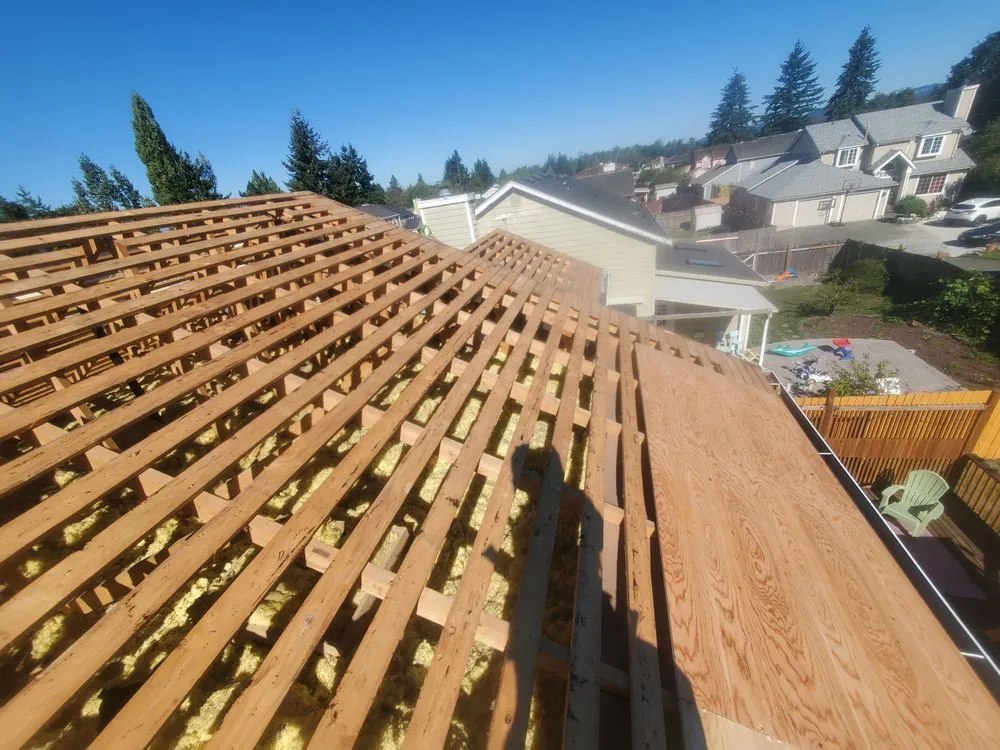 Slide of E&J roofing and construction