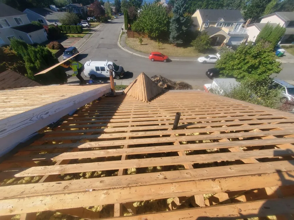 Slide of E&J roofing and construction