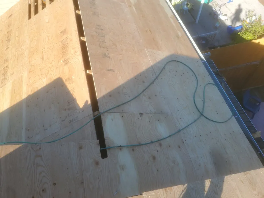 Slide of E&J roofing and construction