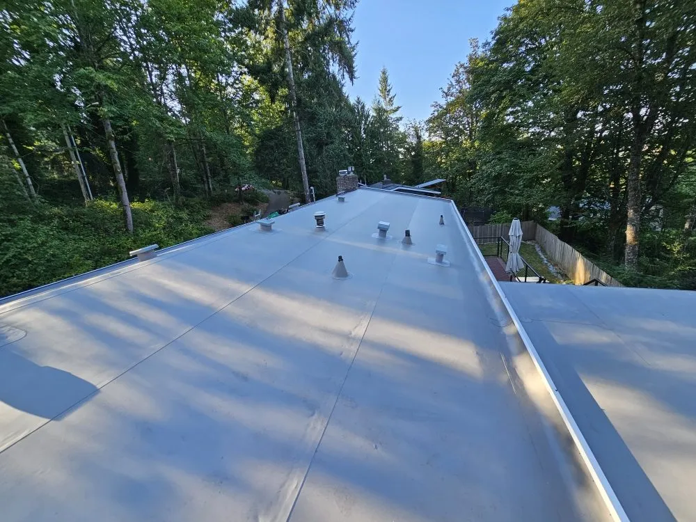 Slide of E&J roofing and construction