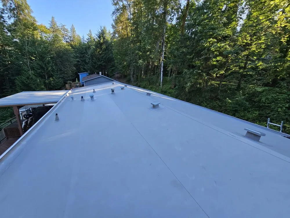 Slide of E&J roofing and construction