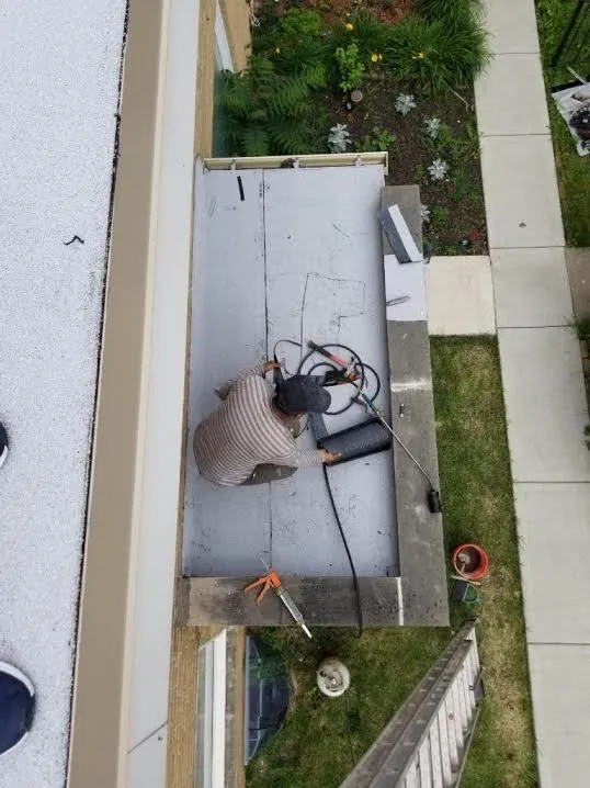 Slide of Eli & Sons Roofing