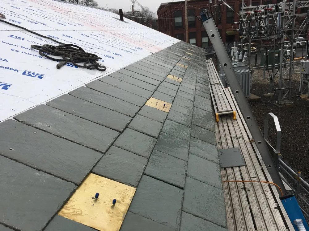 Slide of Elite Roofing & Restoration
