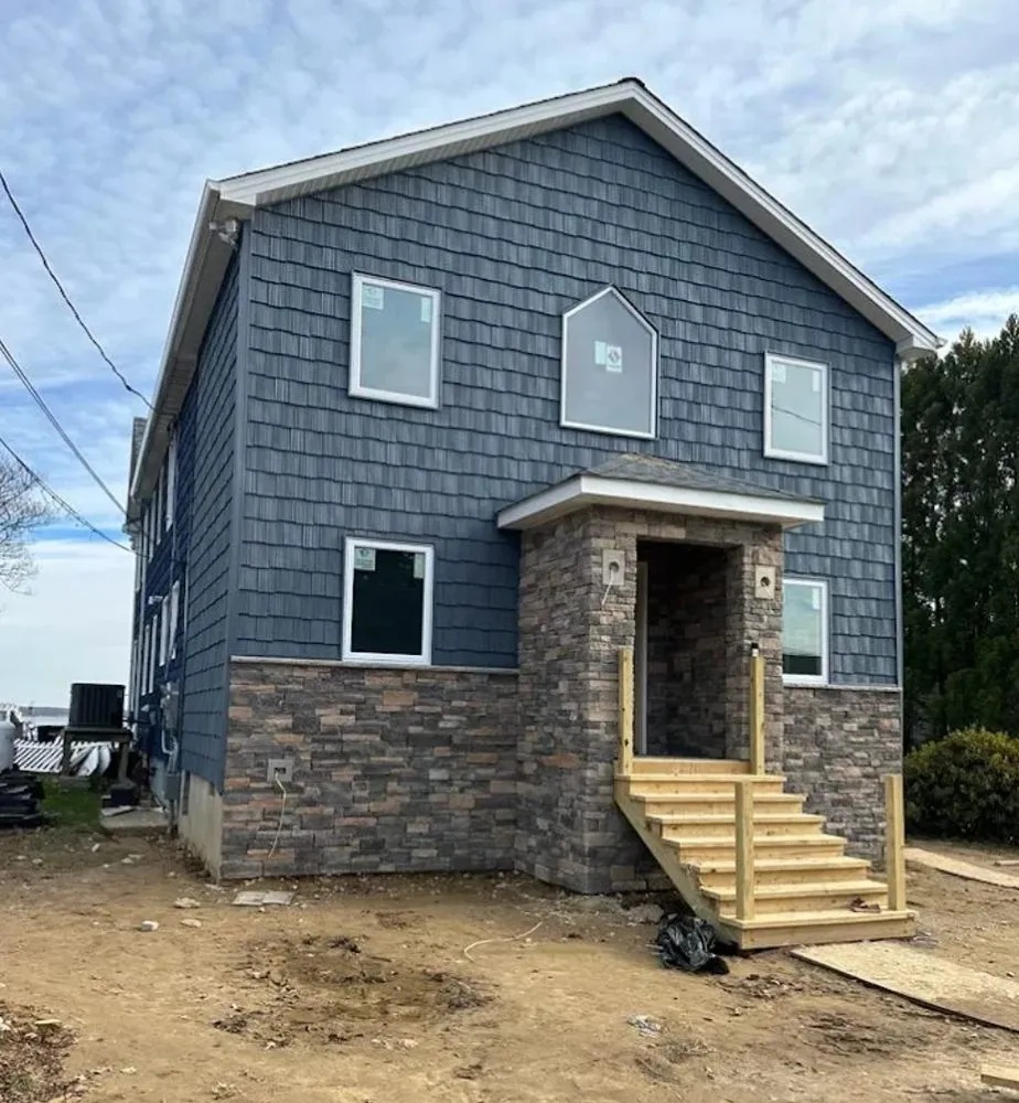 Slide of Elite Siding Gutters Roofing