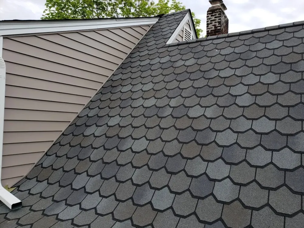 Slide of Elite Siding Gutters Roofing