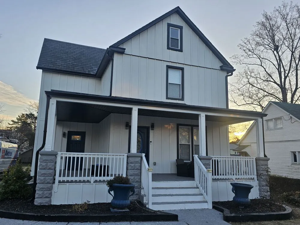 Slide of Elite Siding Gutters Roofing