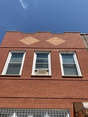 Em Construction Logo