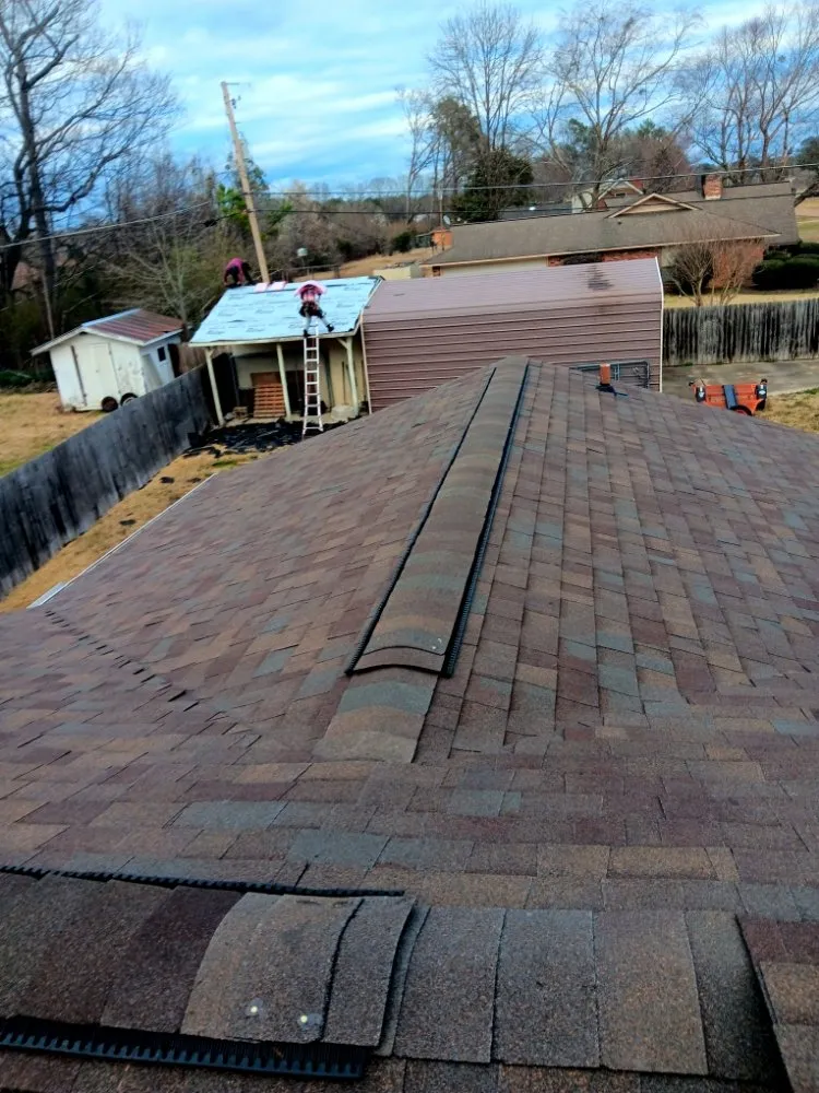 Slide of E&M Roofing