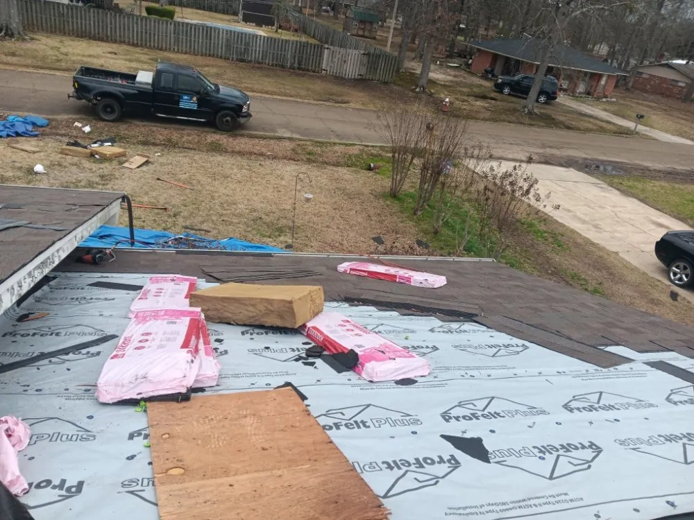 Slide of E&M Roofing