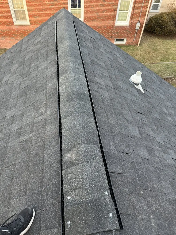Slide of EM Roofing