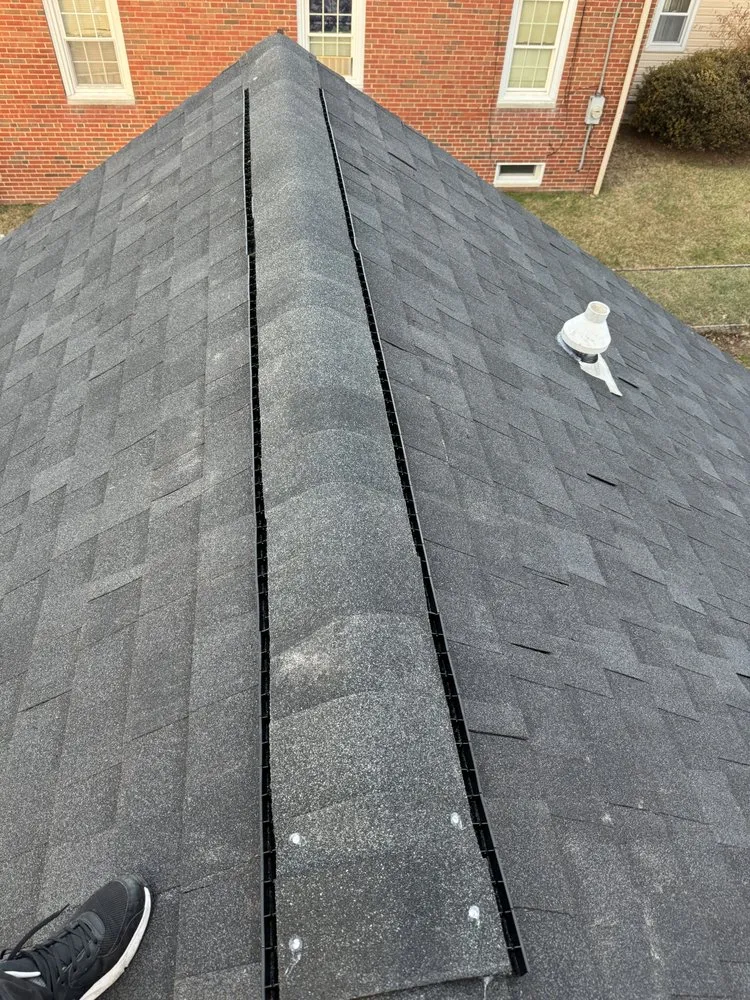 Slide of EM Roofing