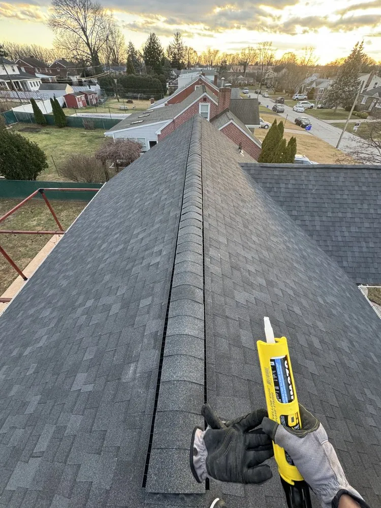 Slide of EM Roofing