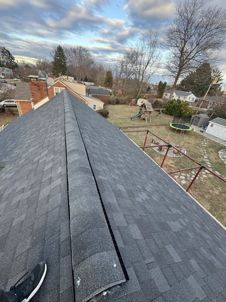 Slide of EM Roofing