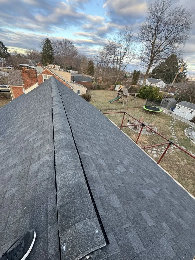 Slide of EM Roofing