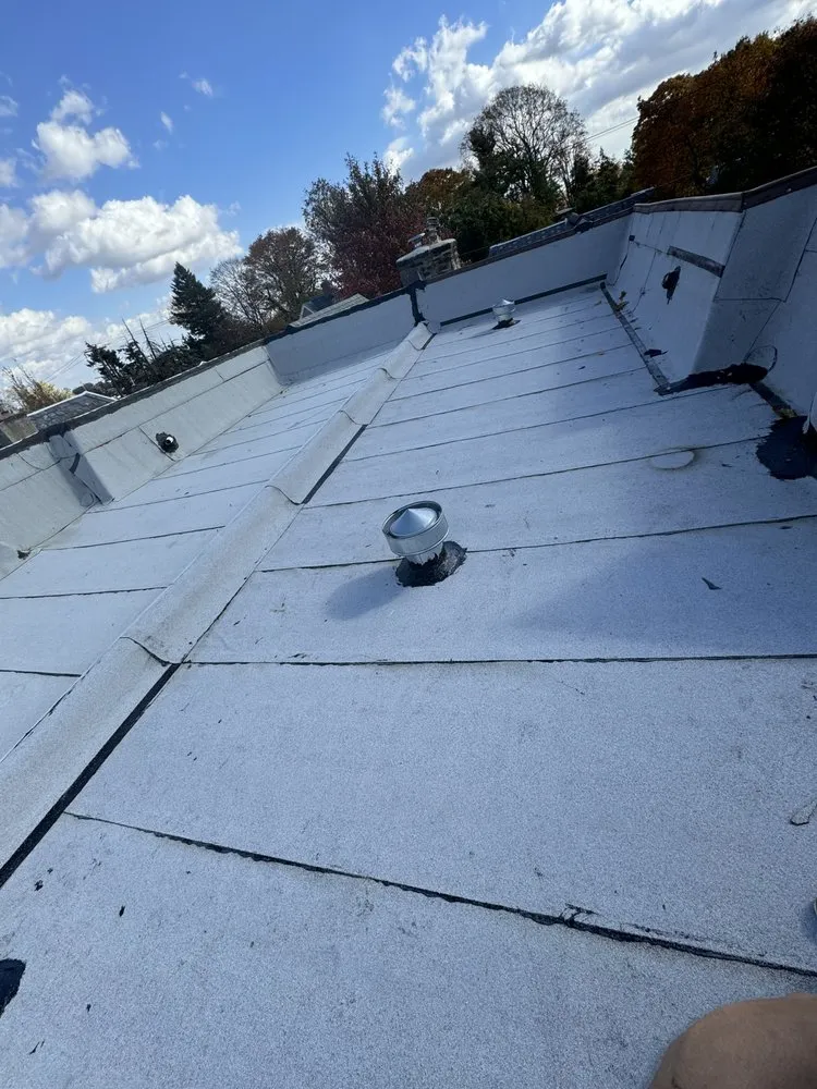 Slide of EM Roofing